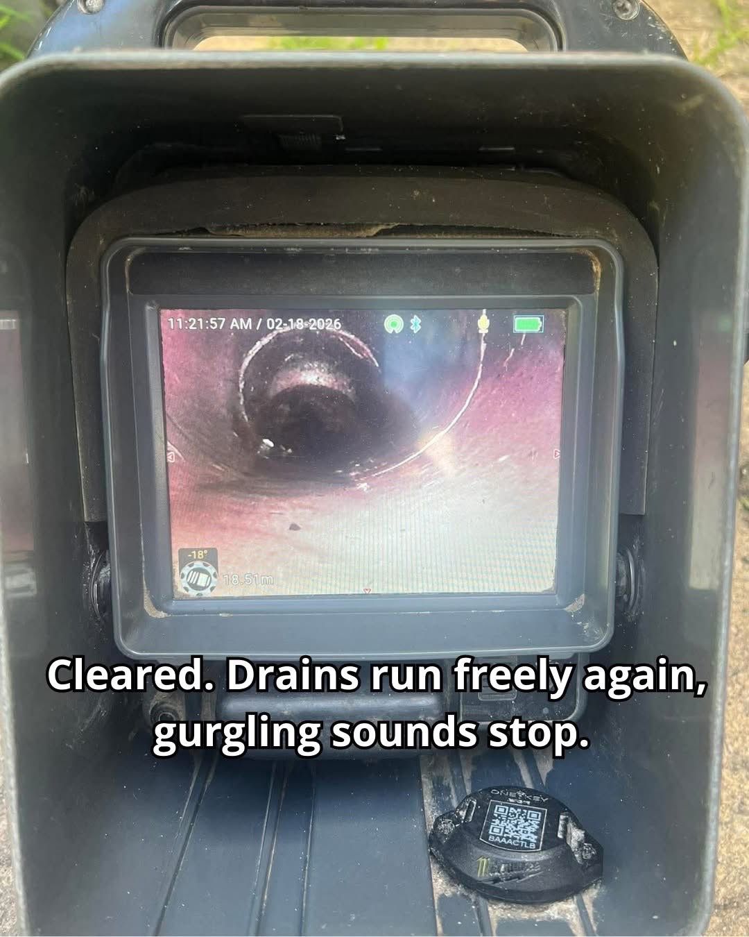 CCTV drain camera monitor showing cleared pipe