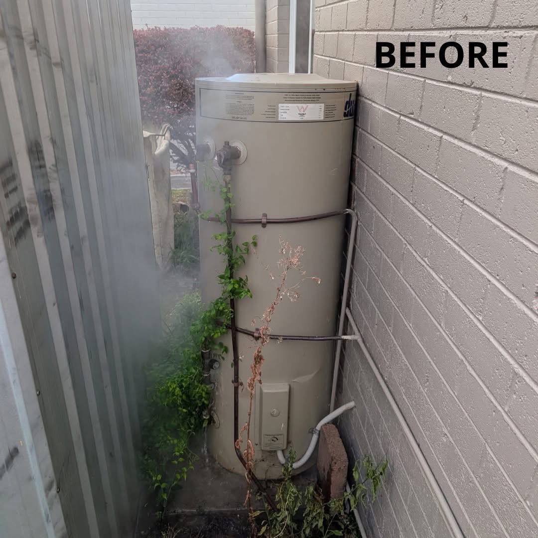 Old failing hot water system with corrosion – before