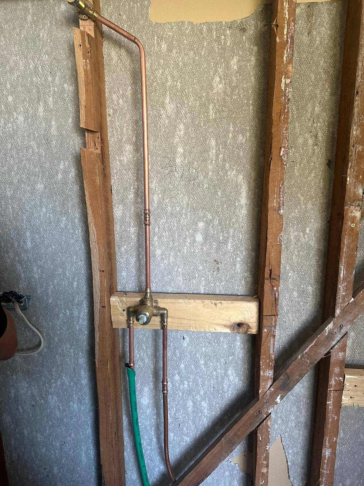 Copper pipe shower rough-in inside wall frame