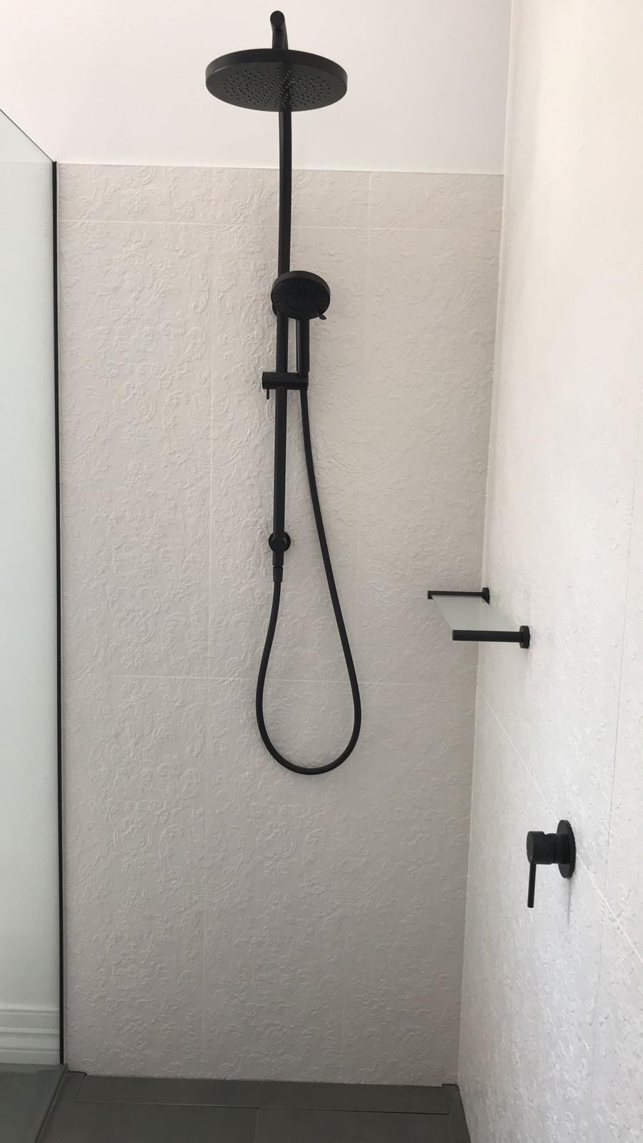 Completed matte black shower fitout with rain head